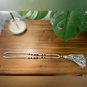 Women’s black and white beaded snow leopard tassel necklace